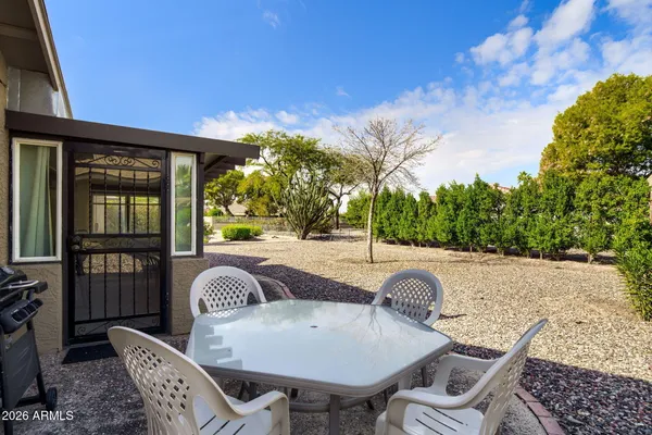 a living room with lots of furniture and painting on the wall