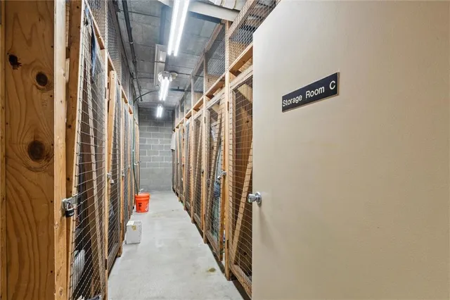 a view of a hallway with wooden floor and entryway