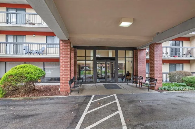 a front view of a building with outdoor space