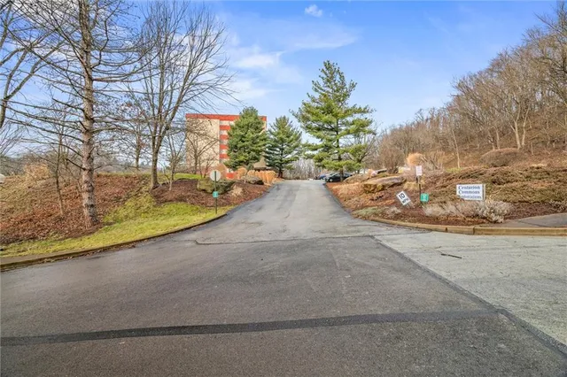 a front view of a building with garden