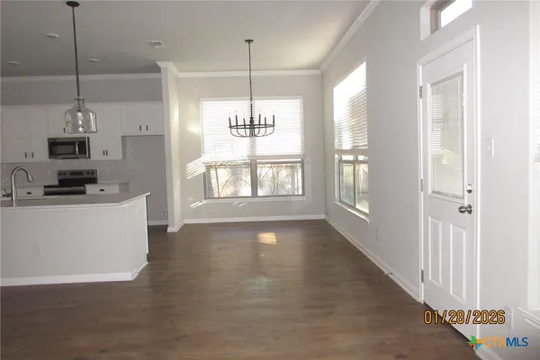 a bathroom with a sink and cabinets