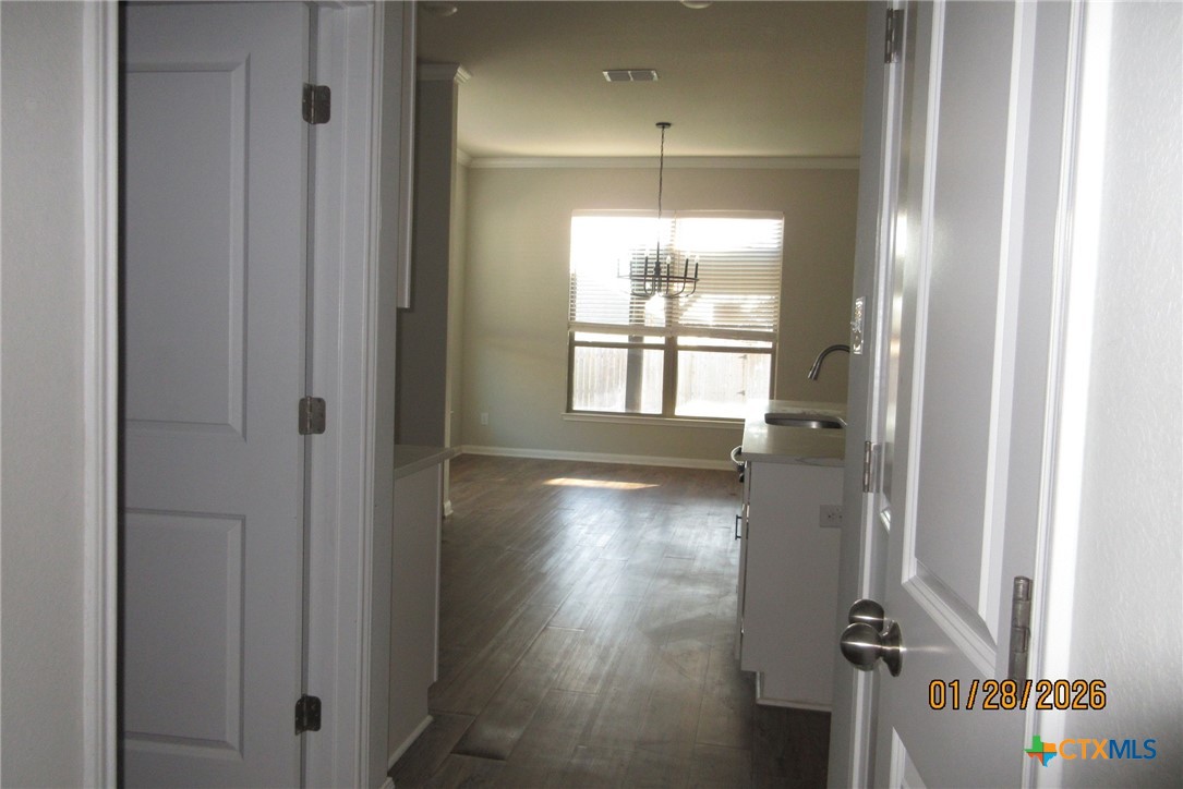 7311 Birdsnest Way Temple, TX 76502 - Photo 17 of 25 a view of empty room with wooden floor and fan
