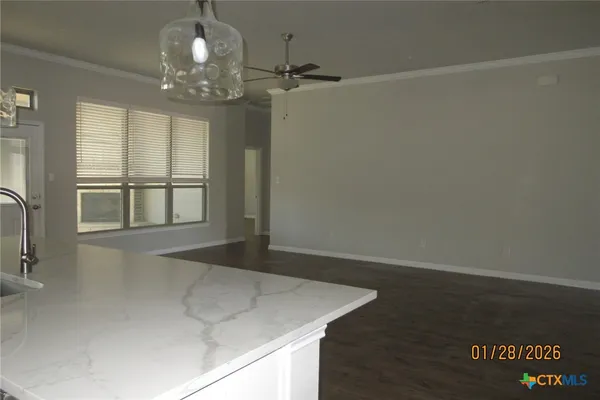 a kitchen with a sink and a mirror