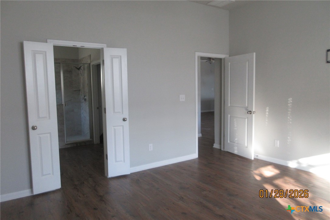 7311 Birdsnest Way Temple, TX 76502 - Photo 22 of 25 a view of an empty room with wooden floor & closet