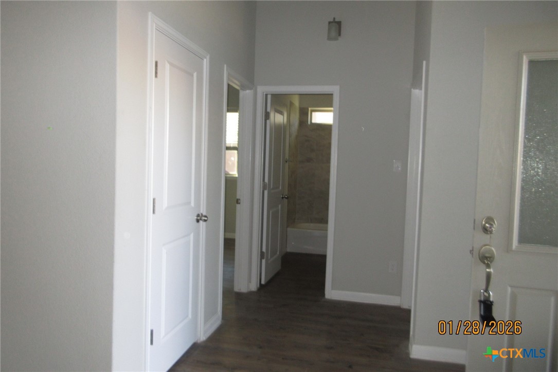 7311 Birdsnest Way Temple, TX 76502 - Photo 4 of 25 a view of a hallway with wooden floor