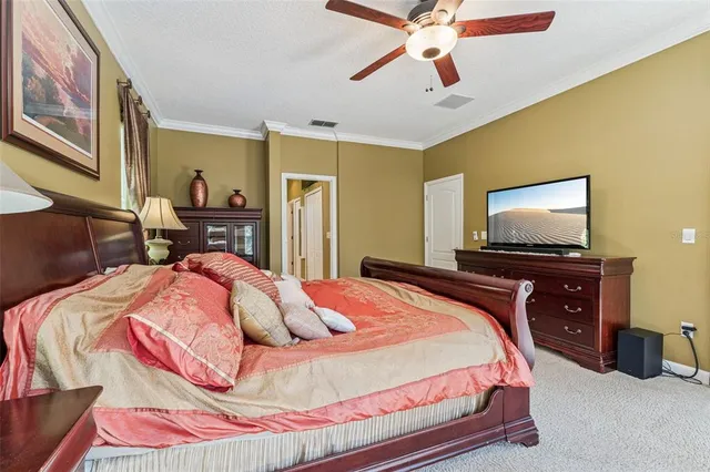 a bedroom with a bed and dresser