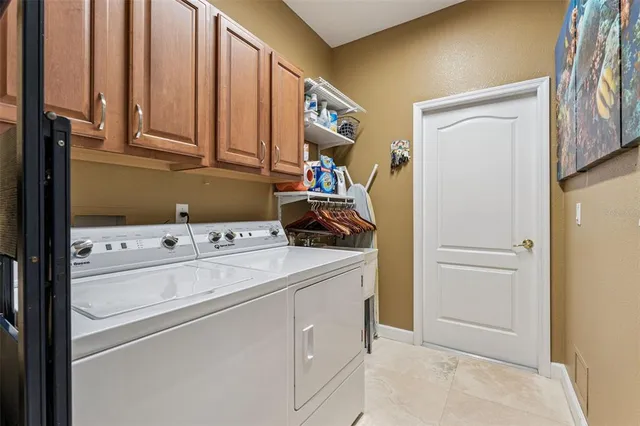 a view of a dining room with furniture wooden floor and chandelier