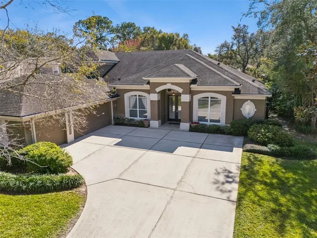 a aerial view of house with yard and swimming pool