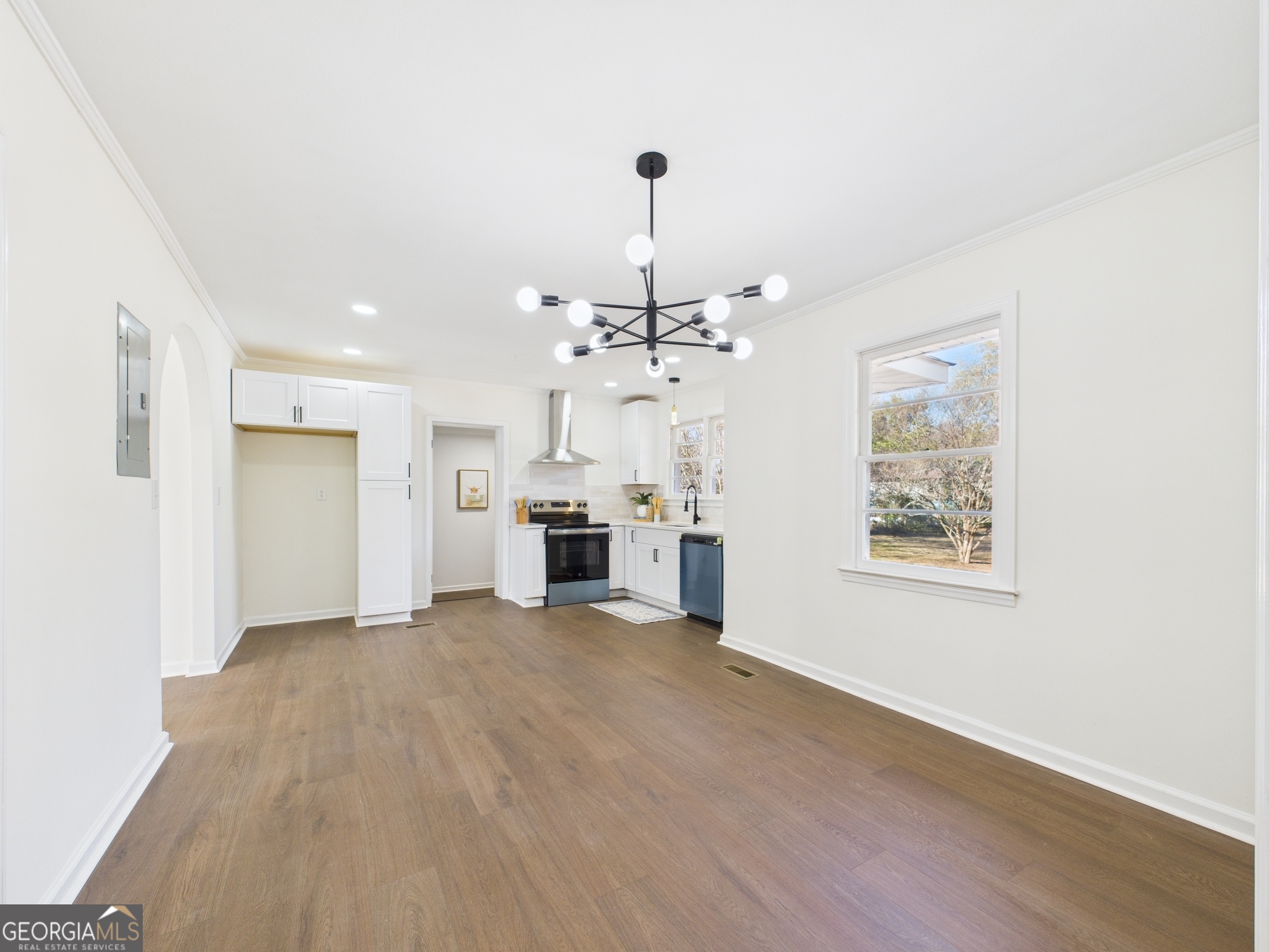 2489 Locksley Drive Macon, GA 31206 - Photo 13 of 42 a view of a kitchen with a sink cabinet and a living room
