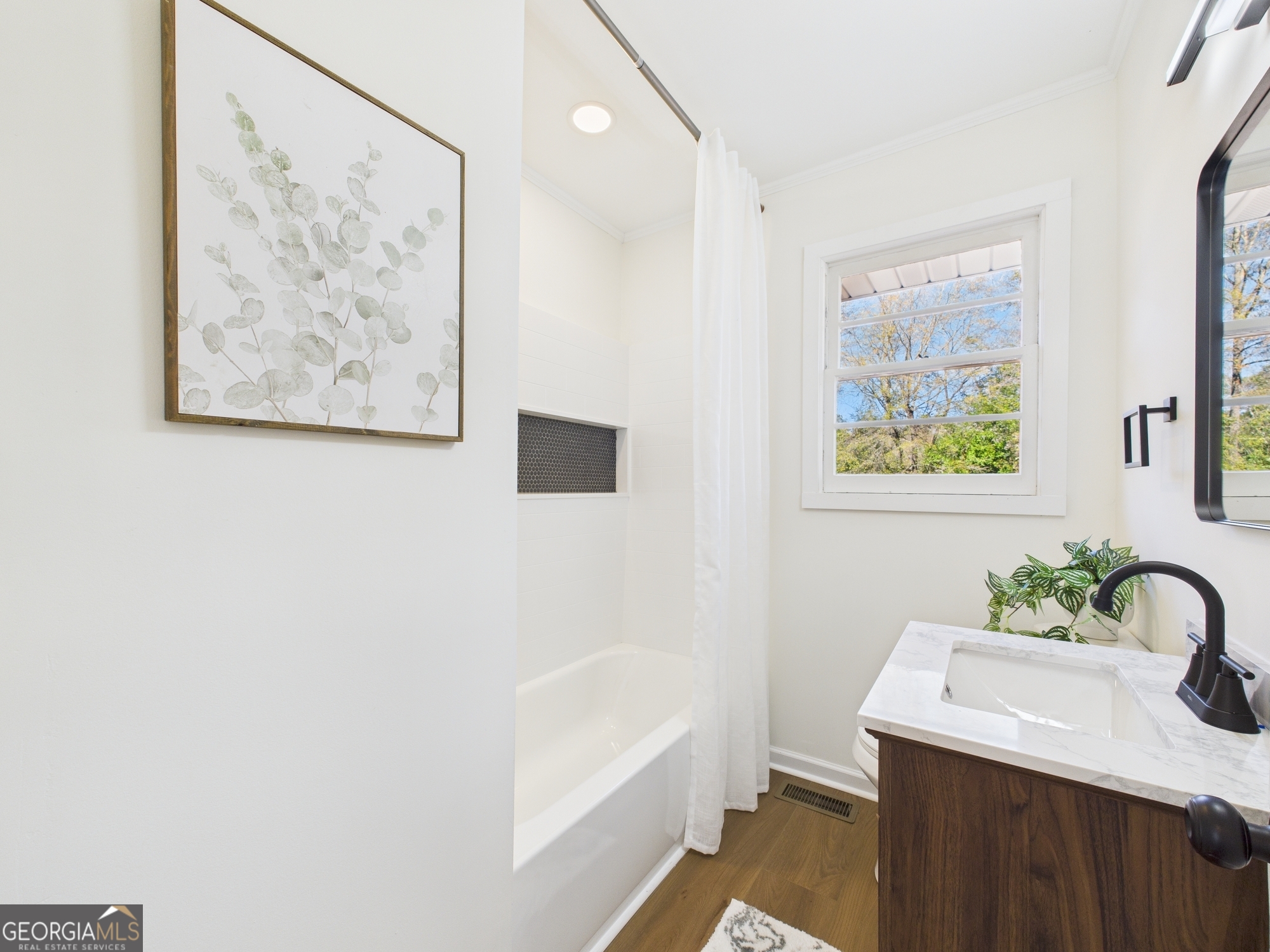 2489 Locksley Drive Macon, GA 31206 - Photo 20 of 42 a bathroom with a sink and a bathtub