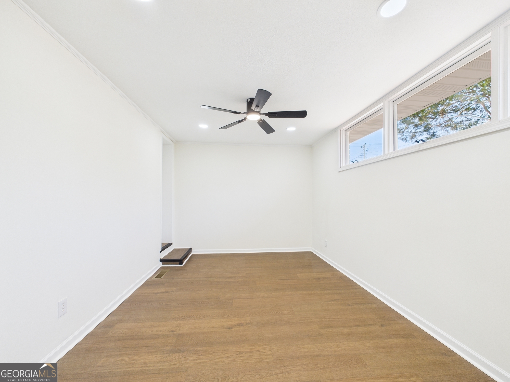 2489 Locksley Drive Macon, GA 31206 - Photo 26 of 42 a view of a room with cabinet and a ceiling fan