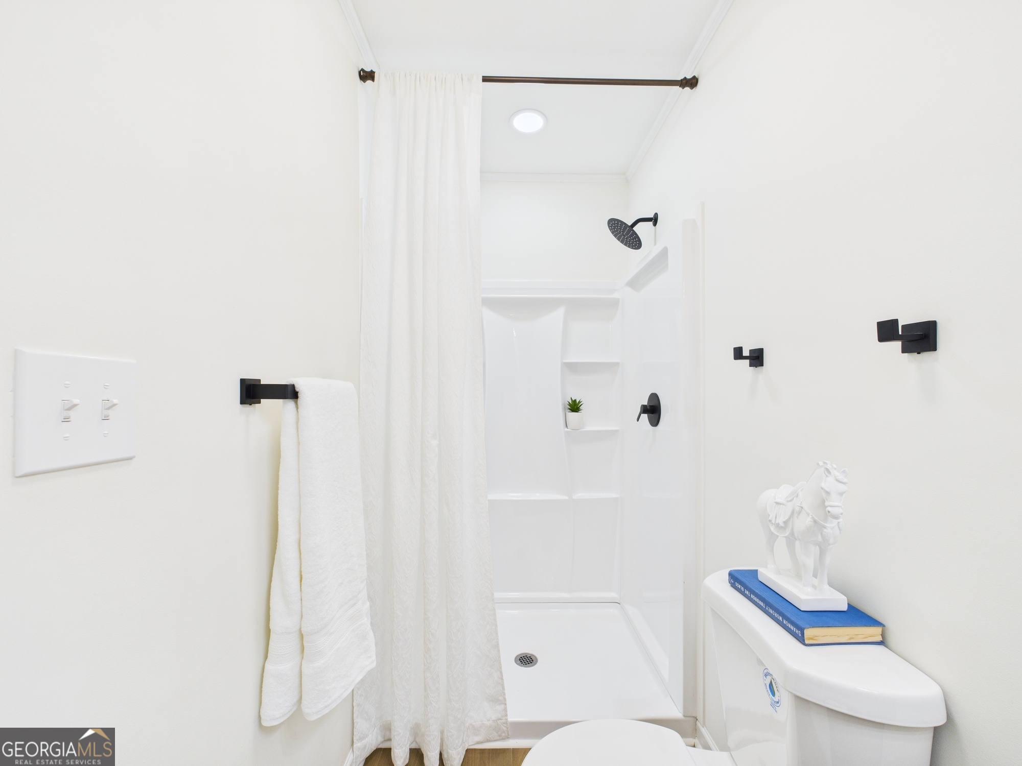 2489 Locksley Drive Macon, GA 31206 - Photo 30 of 42 a bathroom with a shower and toilet