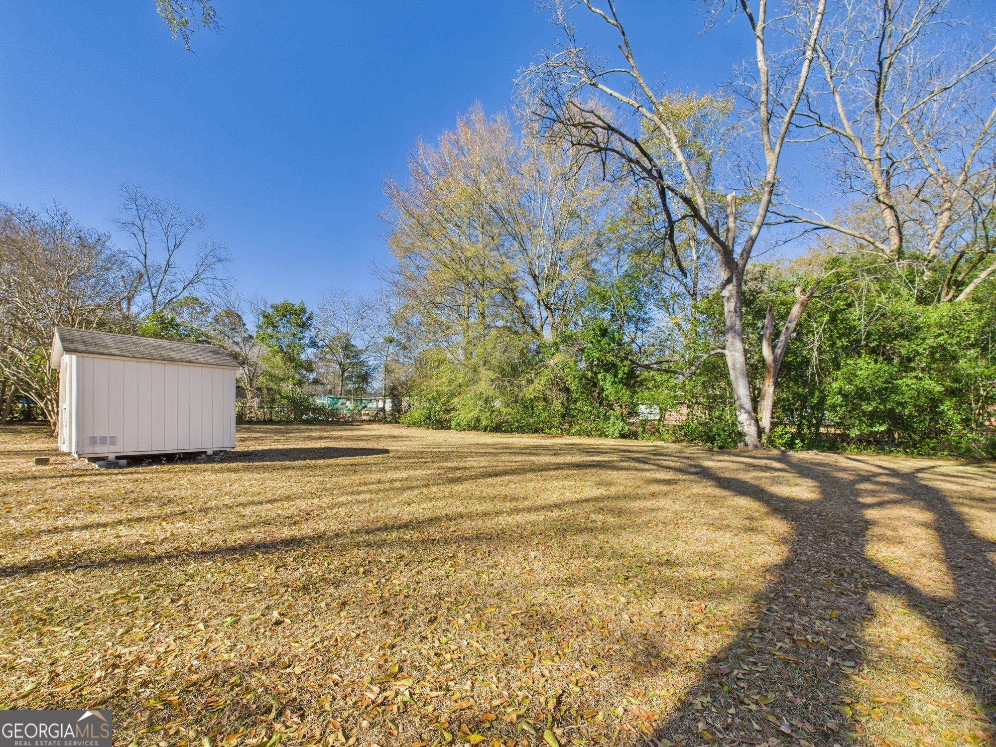 2489 Locksley Drive Macon, GA 31206 - Photo 38 of 42 a view of a house with a yard and garage