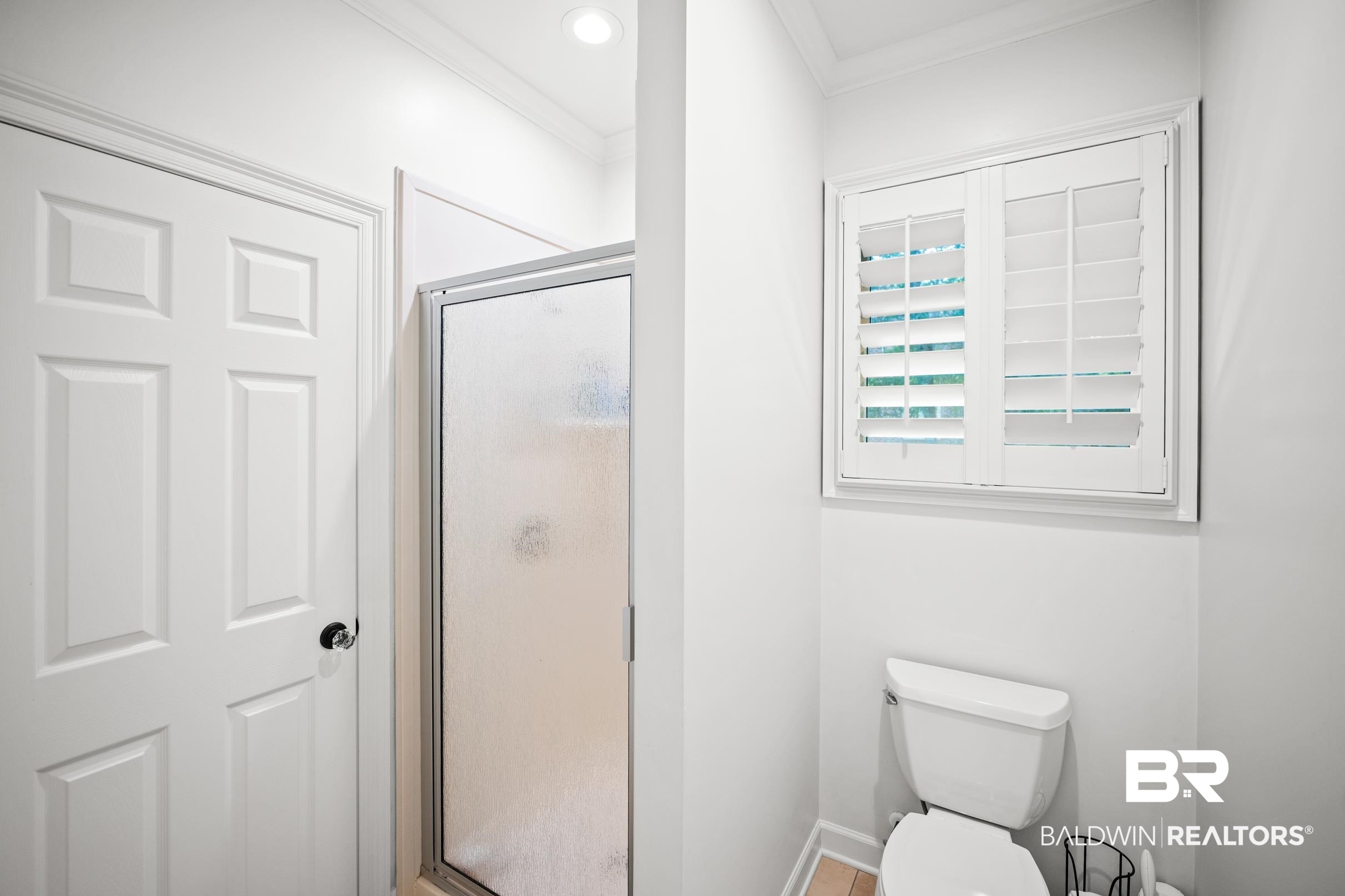 115 Sandy Ford Road Fairhope, AL 36532 - Photo 38 of 47 Bathroom with crown molding and a stall shower