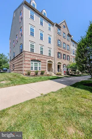 a view of a building with a yard