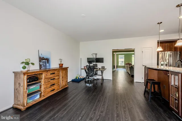 a bed room with furniture and a book shelf