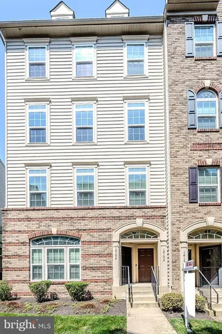 a front view of a house with yard