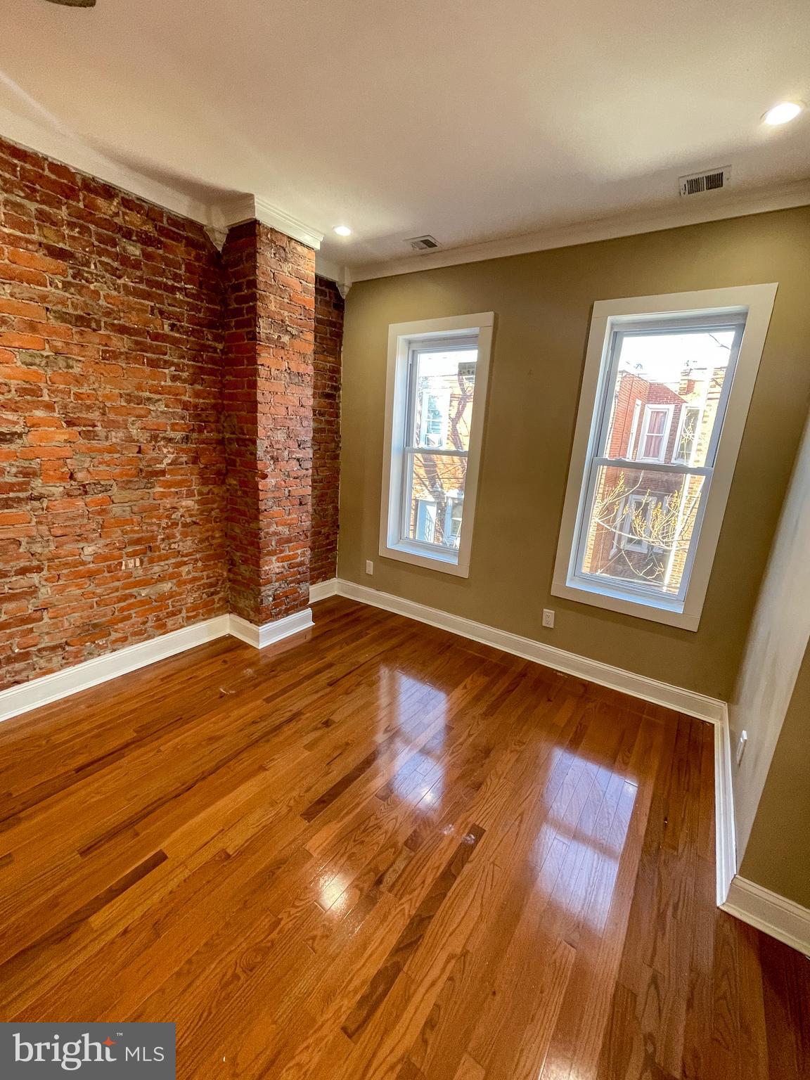 122 North 53rd Street Philadelphia, PA 19139 - Photo 2 of 11 a view of an empty room with wooden floor and a window