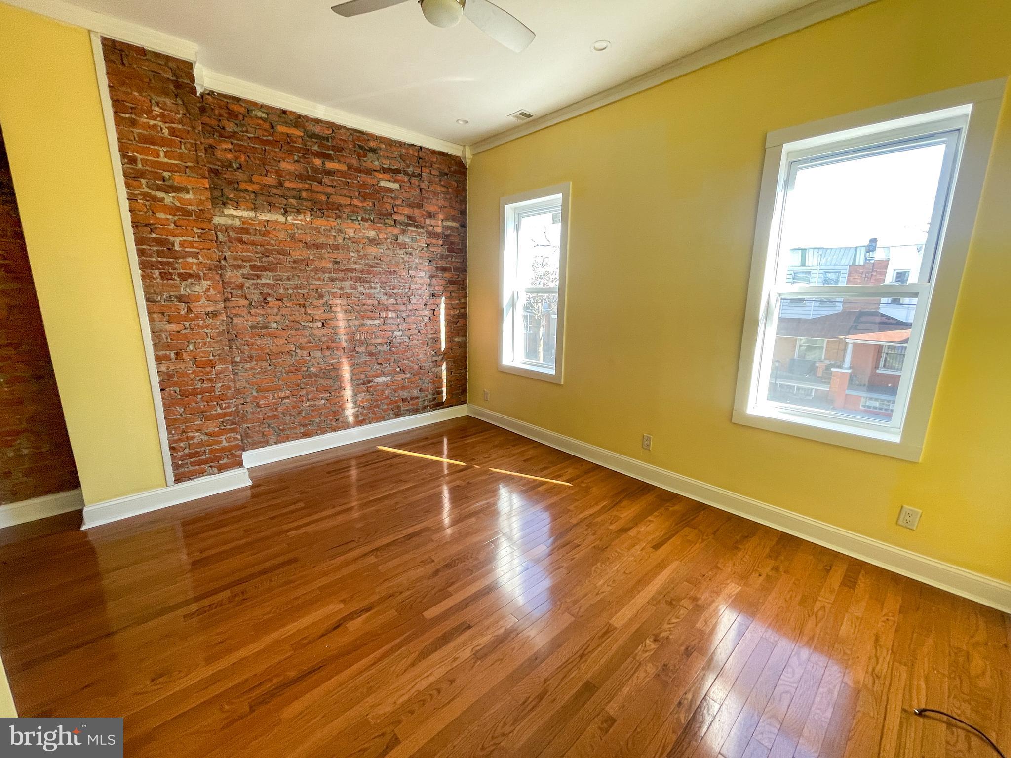 122 North 53rd Street Philadelphia, PA 19139 - Photo 9 of 11 a view of an empty room with wooden floor and a window