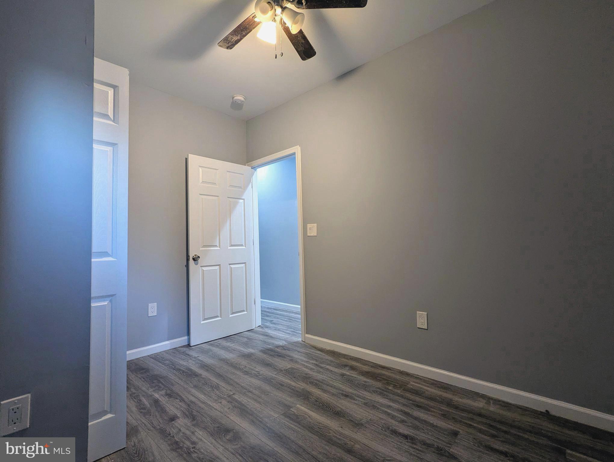 626 North Payson Street Baltimore, MD 21217 - Photo 13 of 23 an empty room with closet and wooden floor