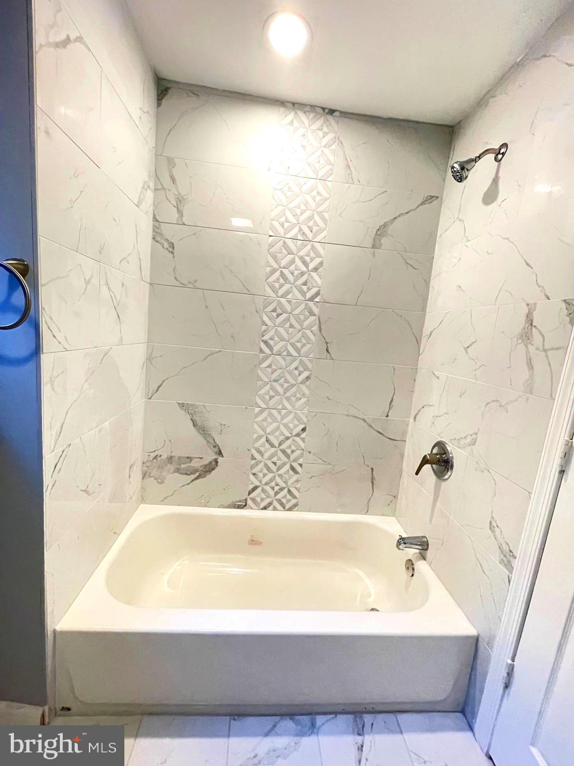 626 North Payson Street Baltimore, MD 21217 - Photo 19 of 23 a bathroom with a bathtub and shower