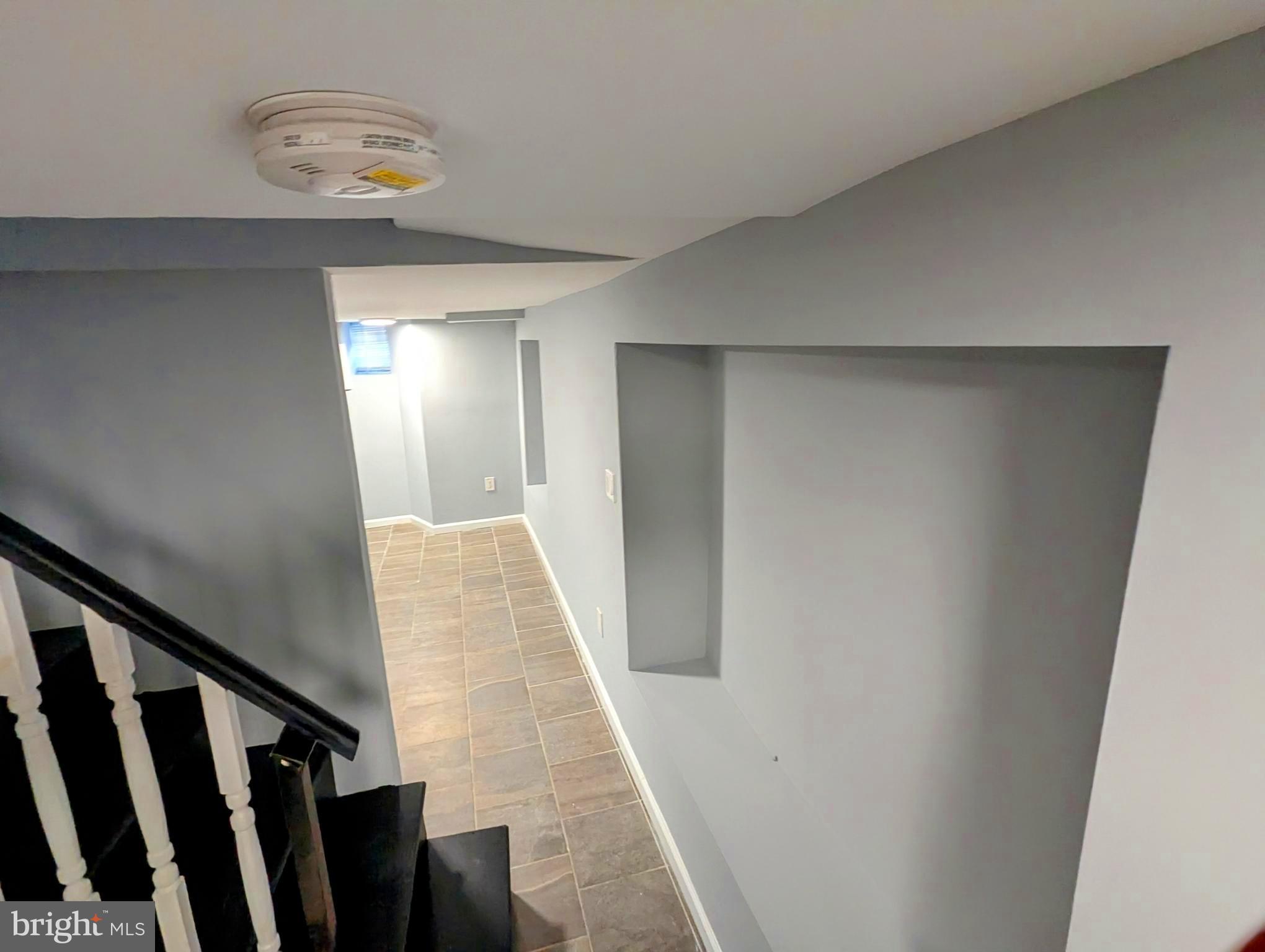 626 North Payson Street Baltimore, MD 21217 - Photo 20 of 23 a view of a hallway with staircase