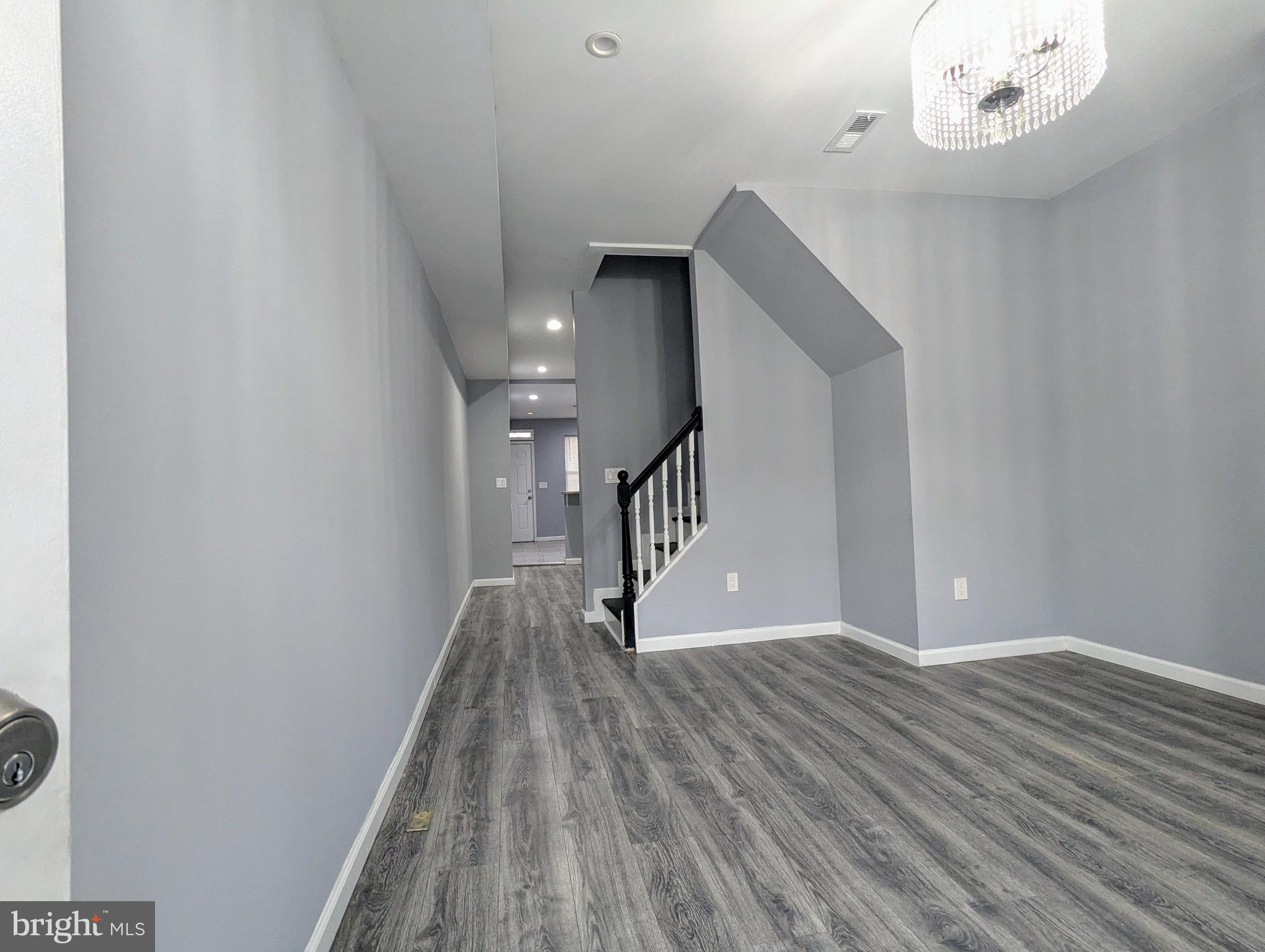626 North Payson Street Baltimore, MD 21217 - Photo 2 of 23 a view of entryway with wooden floor
