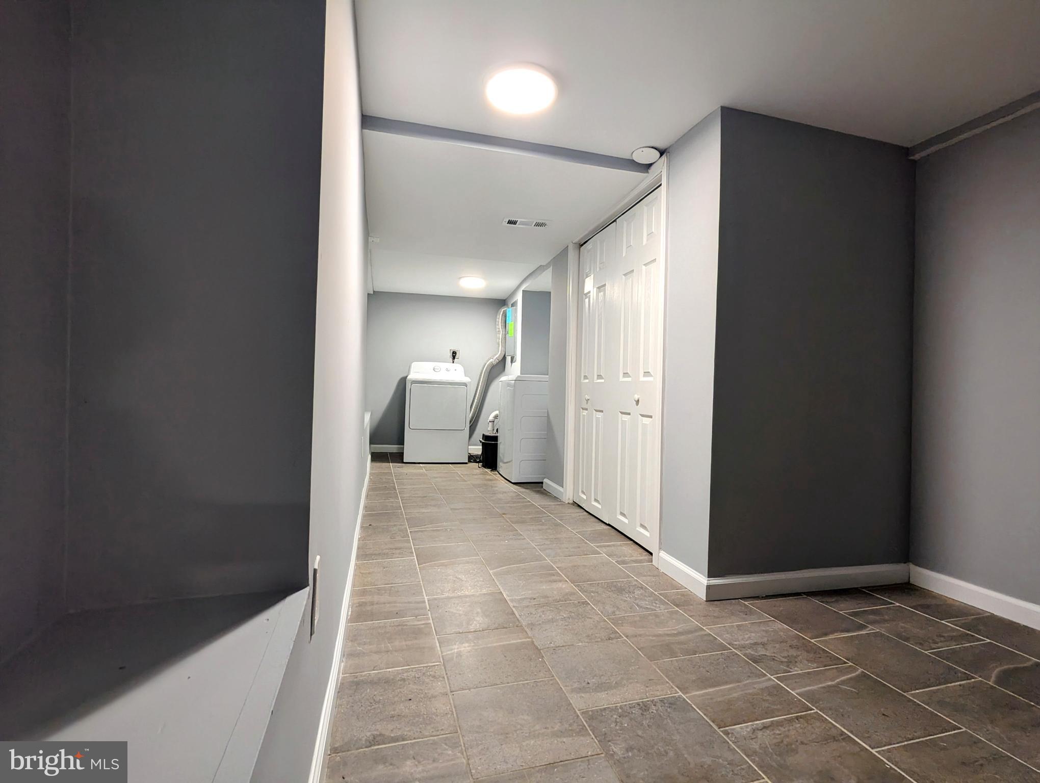 626 North Payson Street Baltimore, MD 21217 - Photo 22 of 23 a view of a room with a furniture and a rug