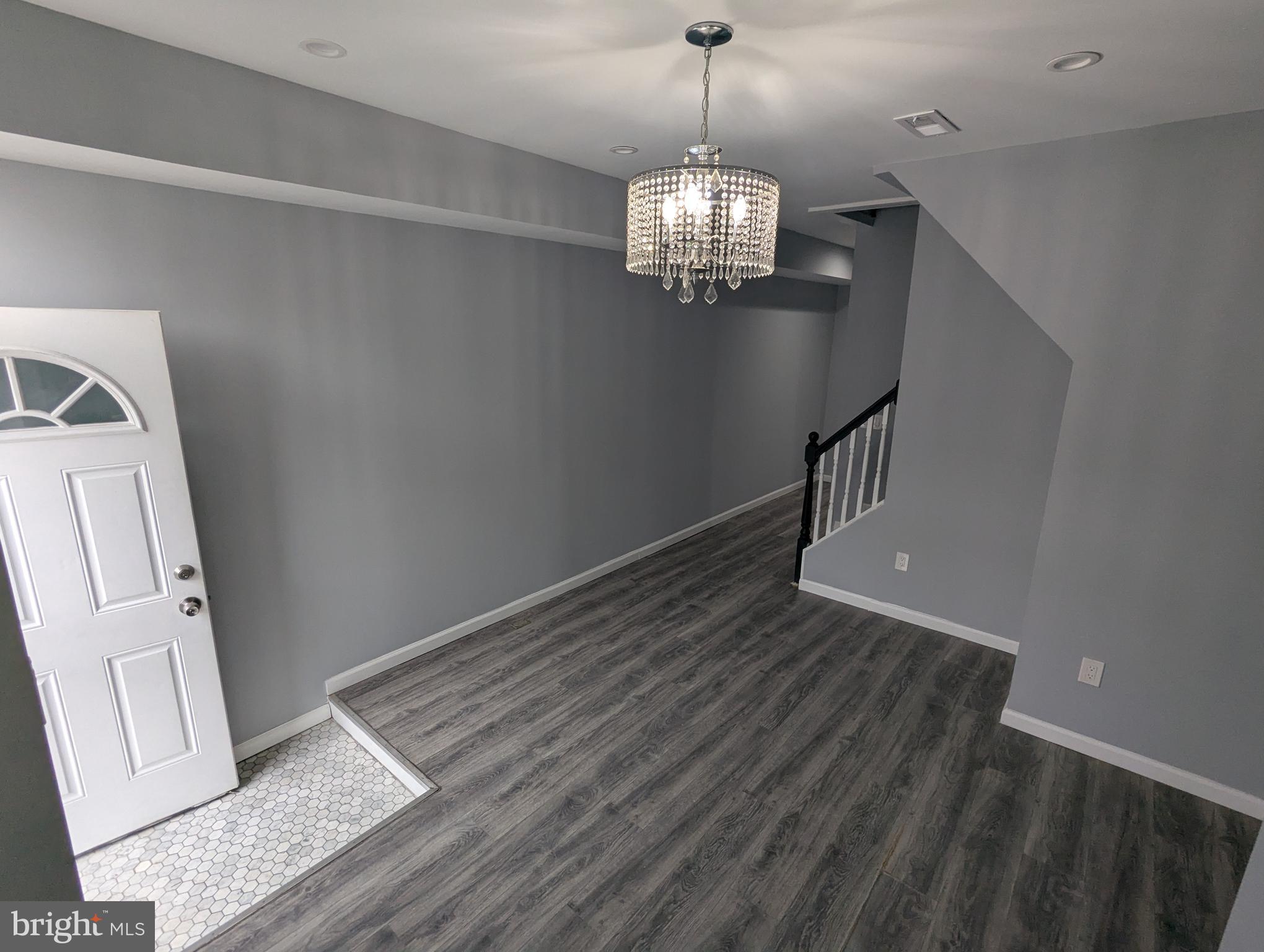 626 North Payson Street Baltimore, MD 21217 - Photo 3 of 23 a view of entryway and hall with wooden floor