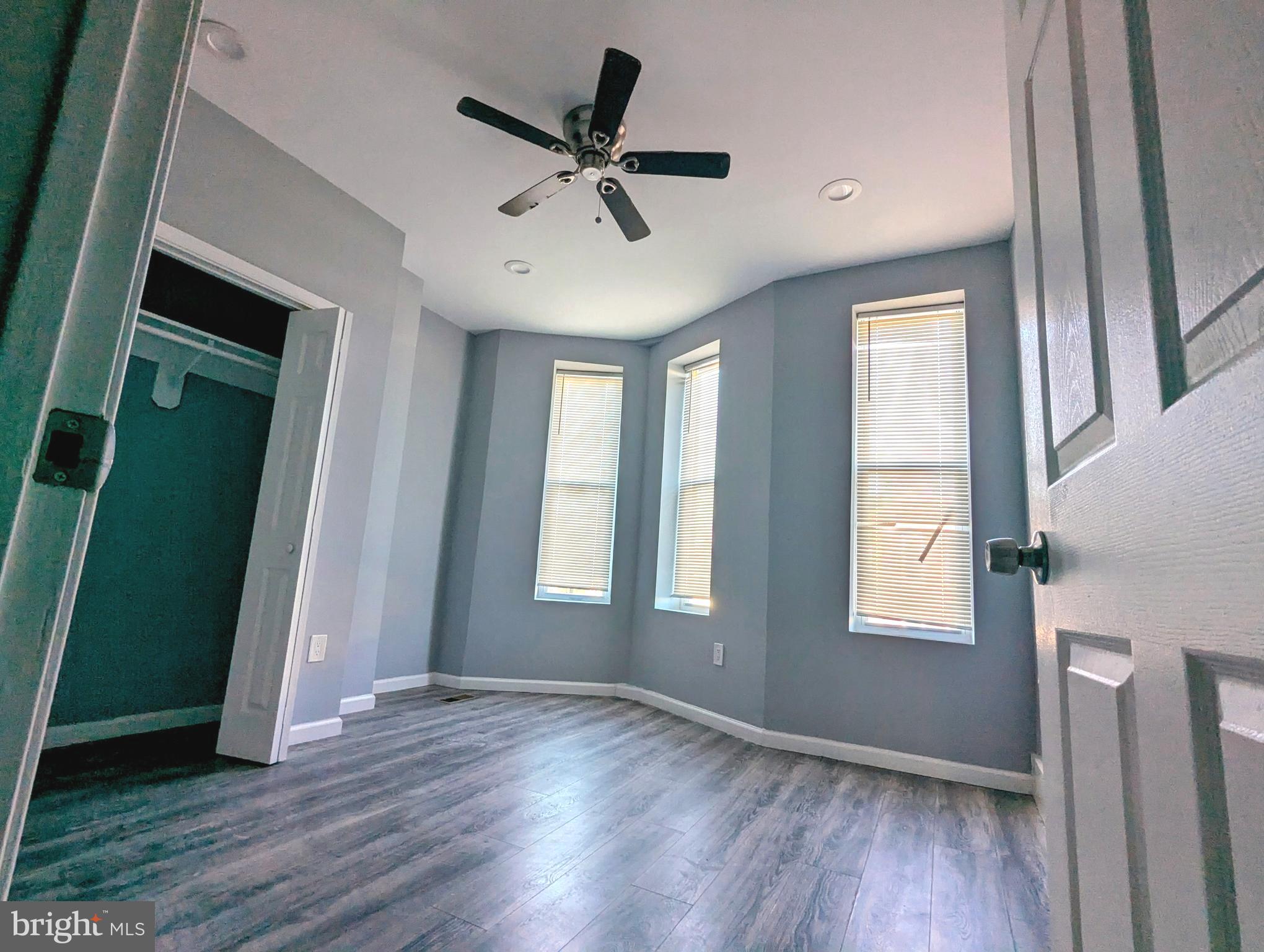 626 North Payson Street Baltimore, MD 21217 - Photo 10 of 23 wooden floor in an empty room with a window