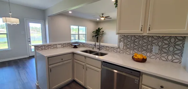 a kitchen with a sink and cabinets