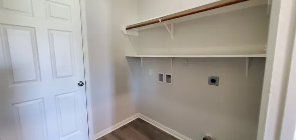 a bathroom with a sink toilet and a mirror