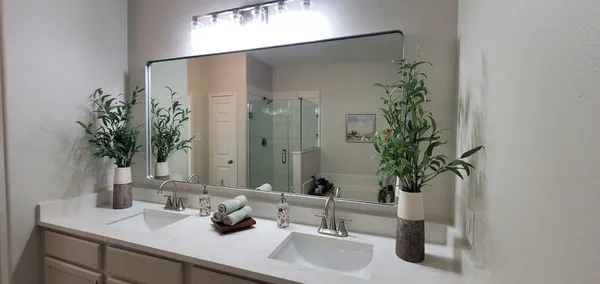 a bathroom with a tub and shower