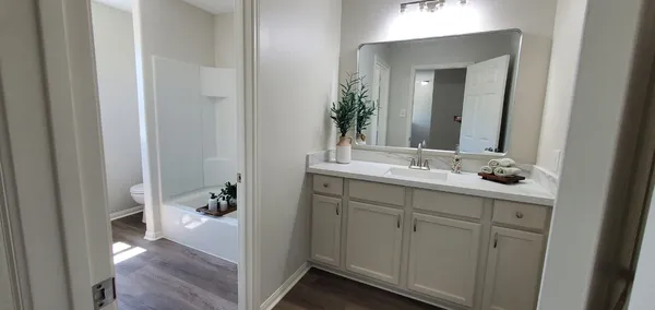 a bathroom with a sink and a window