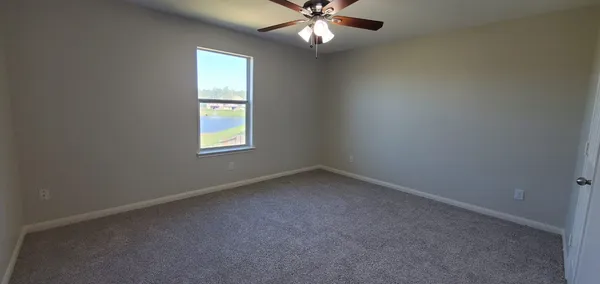 a view of a chandelier fan in a room