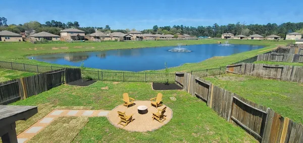 a view of a backyard with swimming pool