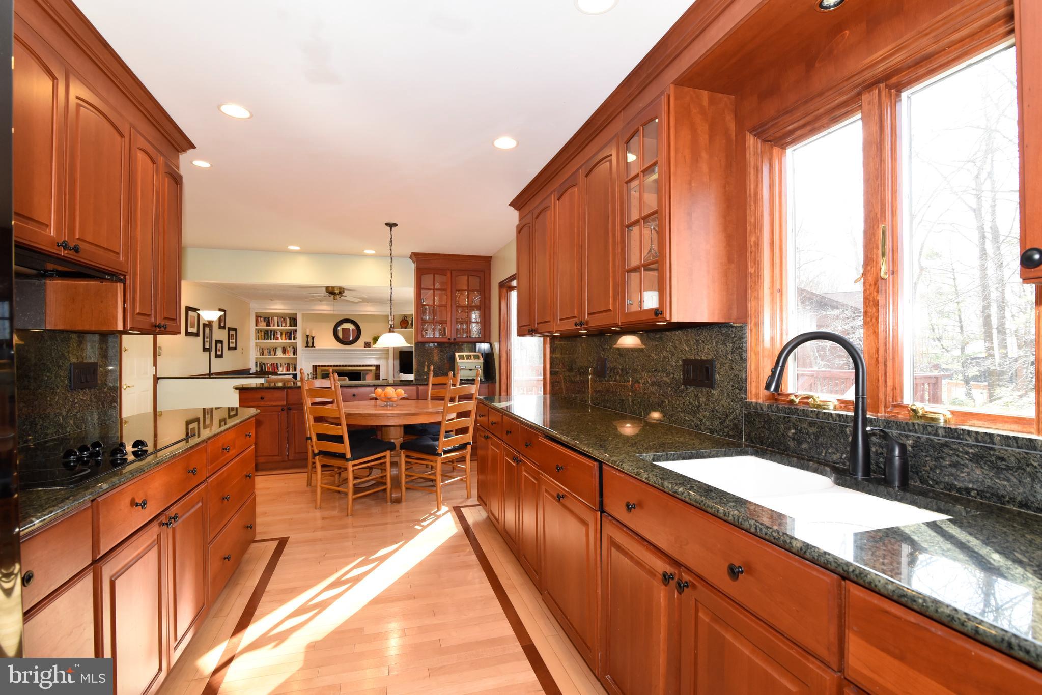 2208 Spinnaker Court Reston, VA 20191 - Photo 13 of 39 a kitchen with stainless steel appliances a sink stove and cabinets