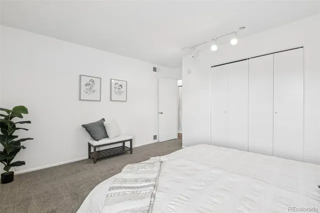 a bedroom with a bed and furniture