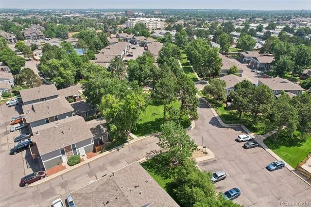 an aerial view of residential houses with outdoor space