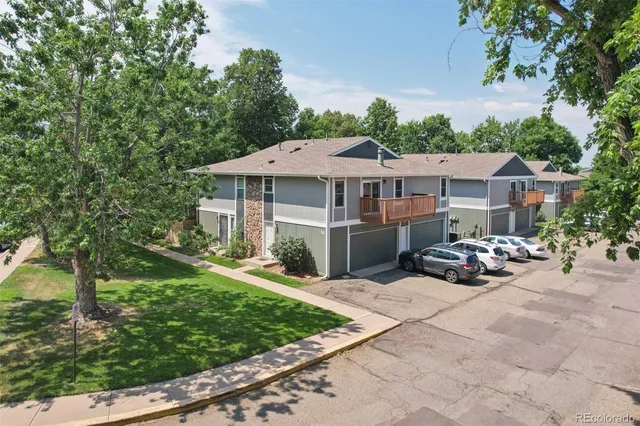 a view of a house with backyard sitting area and garden