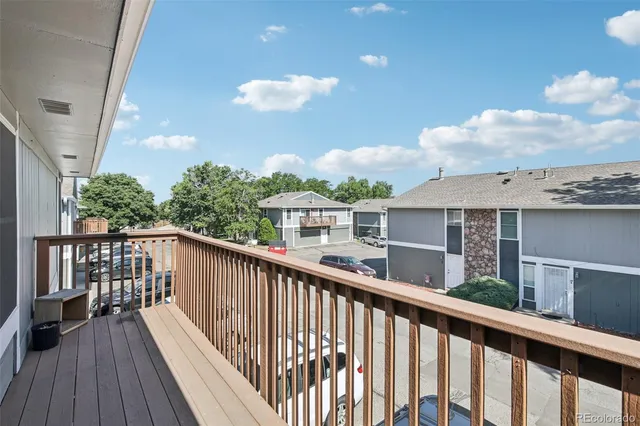 a view of a balcony with wooden floor
