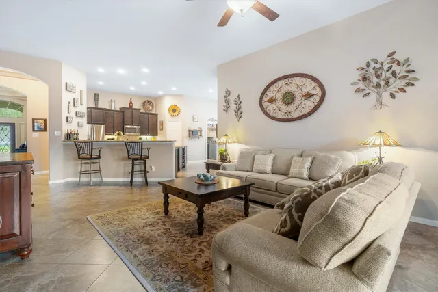 a living room with furniture and a table