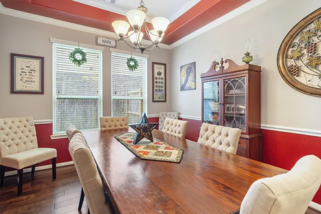 a living room with furniture wooden floor and a window