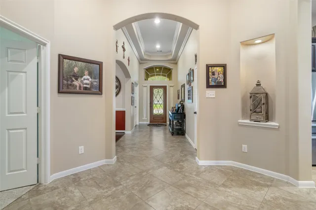 an entryway and a livingroom with furniture