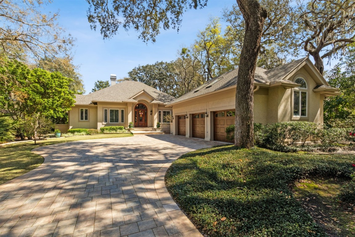 10 Marsh Creek Road Amelia Island, FL 32034 - Photo 1 of 73 a front view of a house with a garden