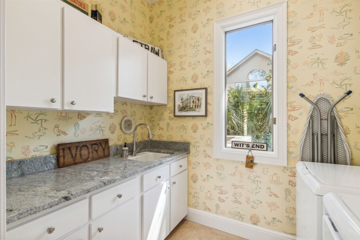10 Marsh Creek Road Amelia Island, FL 32034 - Photo 22 of 73 a kitchen with granite countertop a sink a stove and a granite counter tops