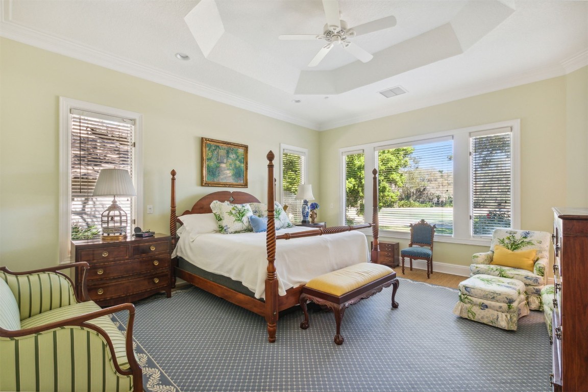 10 Marsh Creek Road Amelia Island, FL 32034 - Photo 25 of 73 a spacious bedroom with a bed and a couch