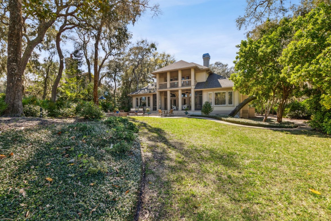 10 Marsh Creek Road Amelia Island, FL 32034 - Photo 37 of 73 a front view of a house with a yard table and chairs