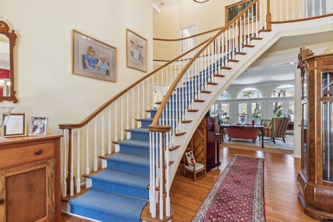 10 Marsh Creek Road Amelia Island, FL 32034 - Photo 4 of 73 a view of staircase with lots of frames on wall and a view of wooden floor