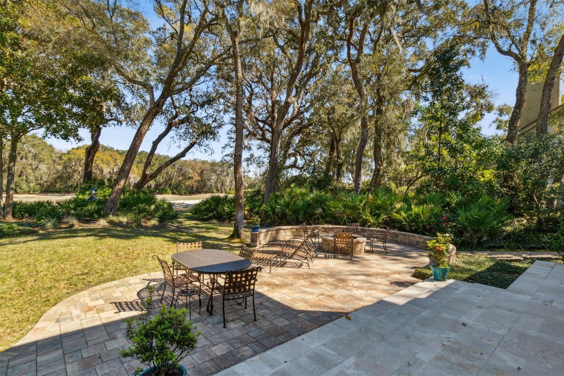 10 Marsh Creek Road Amelia Island, FL 32034 - Photo 43 of 73 a view of a swimming pool with a patio and a yard